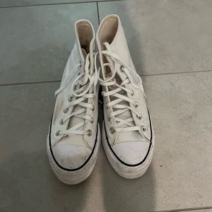 White platform converse worn a few times. Dirt can easily be cleaned off.